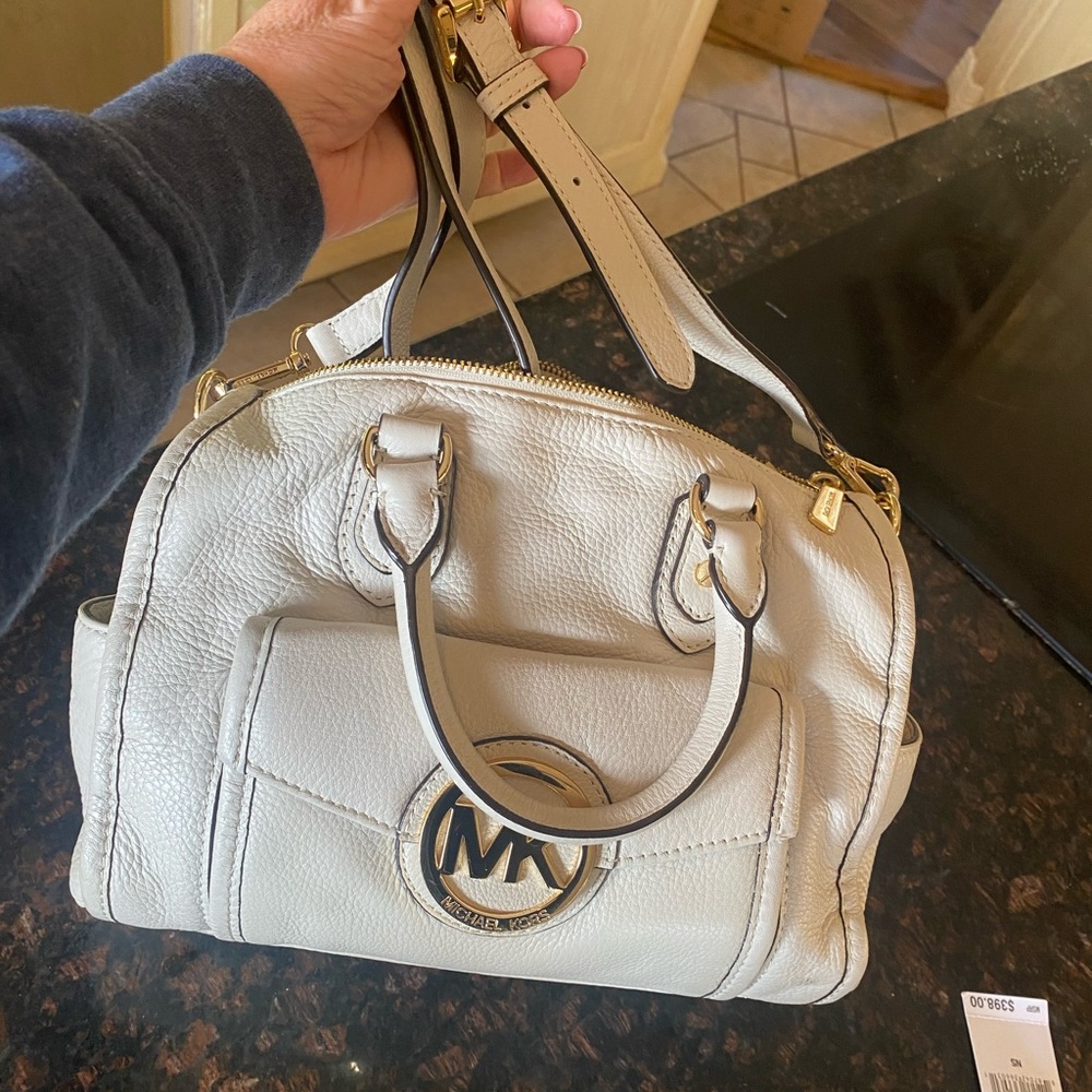 Brand new (tags not on bag). Never carried.